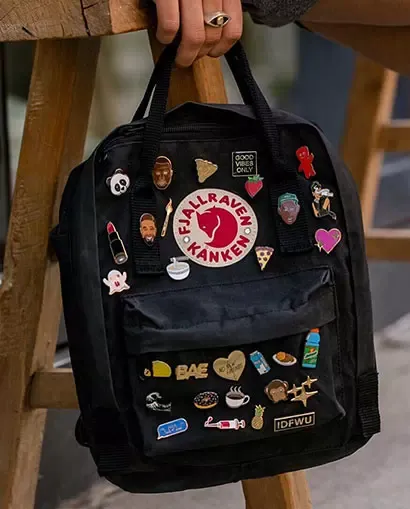 backpack with custom enamel pins
