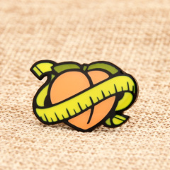 A Peach with Tape Lapel Pins