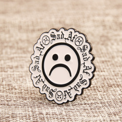 Sad face lapel pins